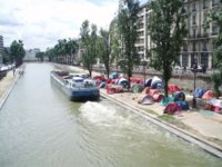 homeless tents canal st martin Paris.jpg