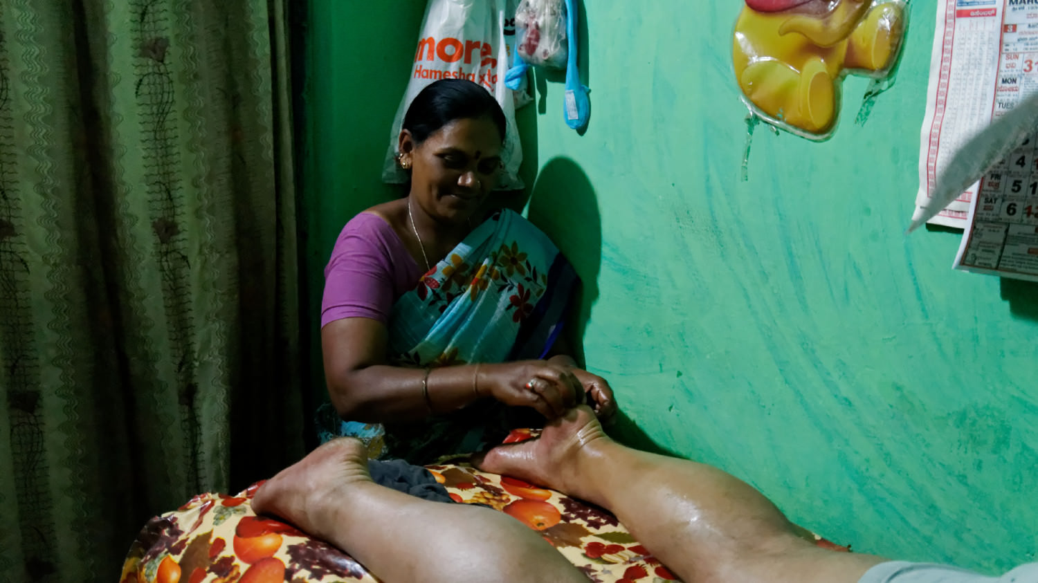 Foot massage. 
Hampi, Karnataka